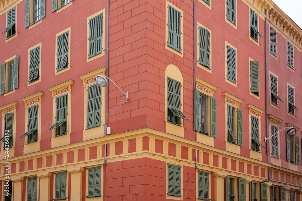 Red painted apartment block in Nice, France