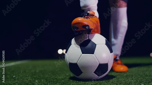 Professional soccer player putting his boot on the ball, 4k slow motion