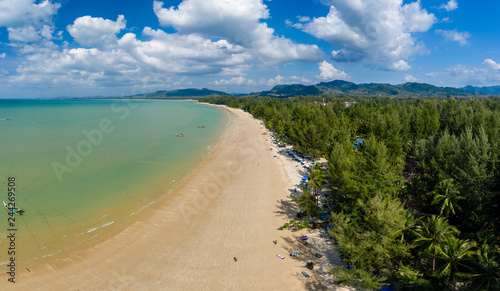 Aerial panoramic view of a beautiful tropical beach with traditional boats surrounded by lush greenery  Khao Lak  Thailand 