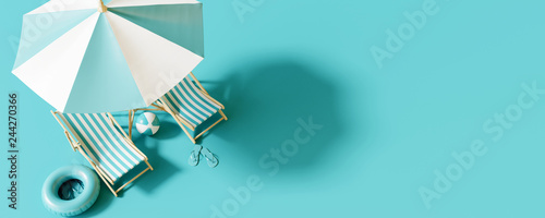 Top view Beach umbrella with chairs and beach accessories on blue background. summer vacation concept. 3d rendering photo