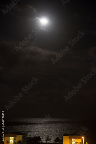 moonlight over some buildings in Naples Florida