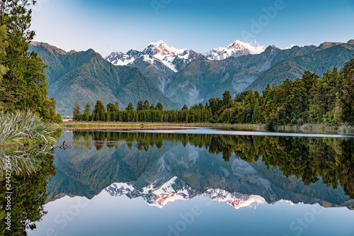 Mirror reflection in the Lake Matheson, New Zealand photo