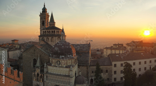 Bergamo, Italy. The old town. Aerial view of the Basilica of Santa Maria Maggiore during the sunset. In the background the Po plain © Matteo Ceruti