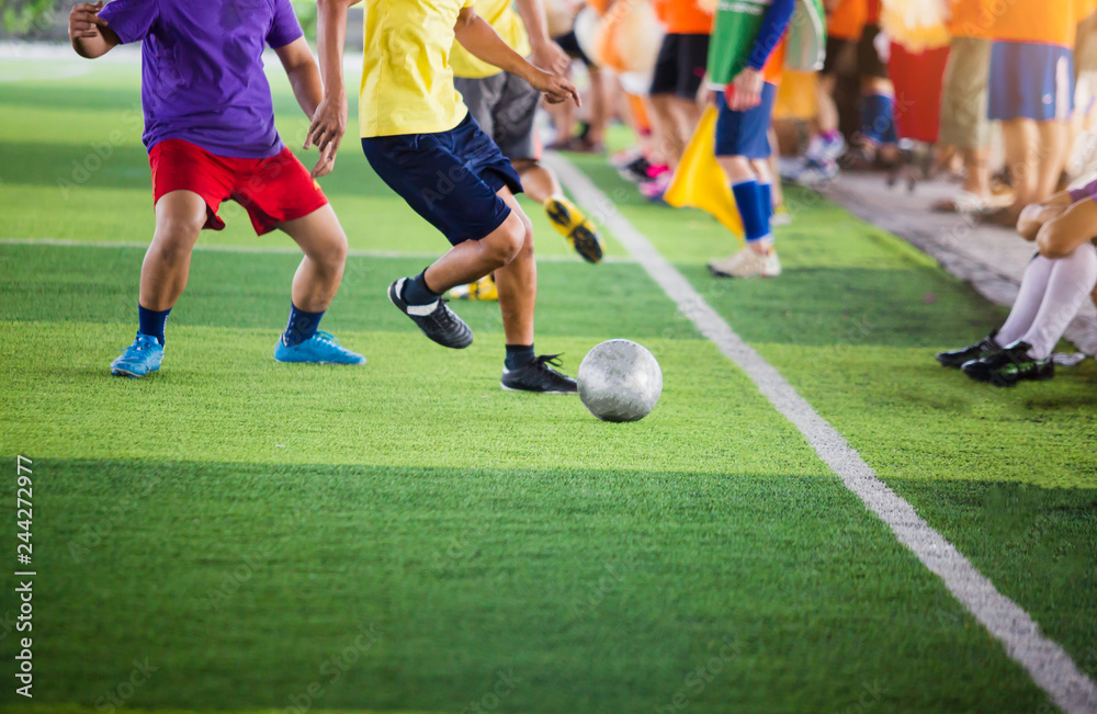 soccer players run to trap and control the ball for shoot to goal with cheerleader team background. soccer players run to trap and control the ball for shoot to goal with cheerleader team background.