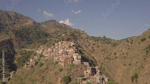Stunning 4k descending drone aerial footage of abandoned ghost town of Roghudi Vecchia, Calabria, Italy.