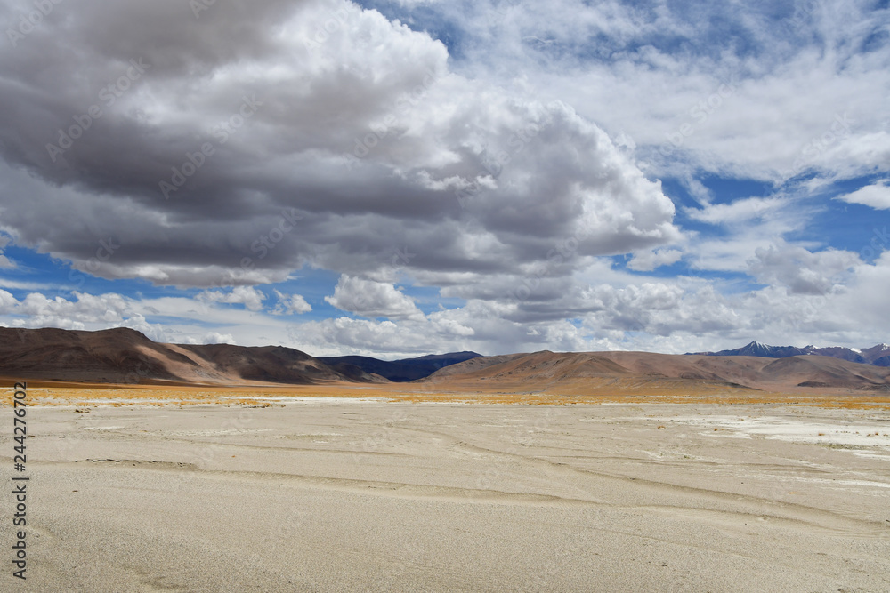 China, Tibet. Transhimalayas on the way to the lake, Ngangla Ring Tso in the summer in cloudy day China, Tibet. Transhimalayas on the way to the lake, Ngangla Ring Tso in the summer in cloudy day