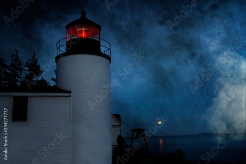 bass harbor head lighthouse on a foggy night in Bass Harbor Maine