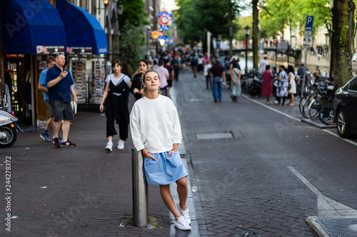 Photography Girl walks through the streets of Amsterdam.