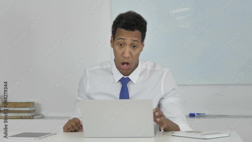 Online Video Chat by Afro-American Businessman at Work Online Video Chat by Afro-American Businessman at Work