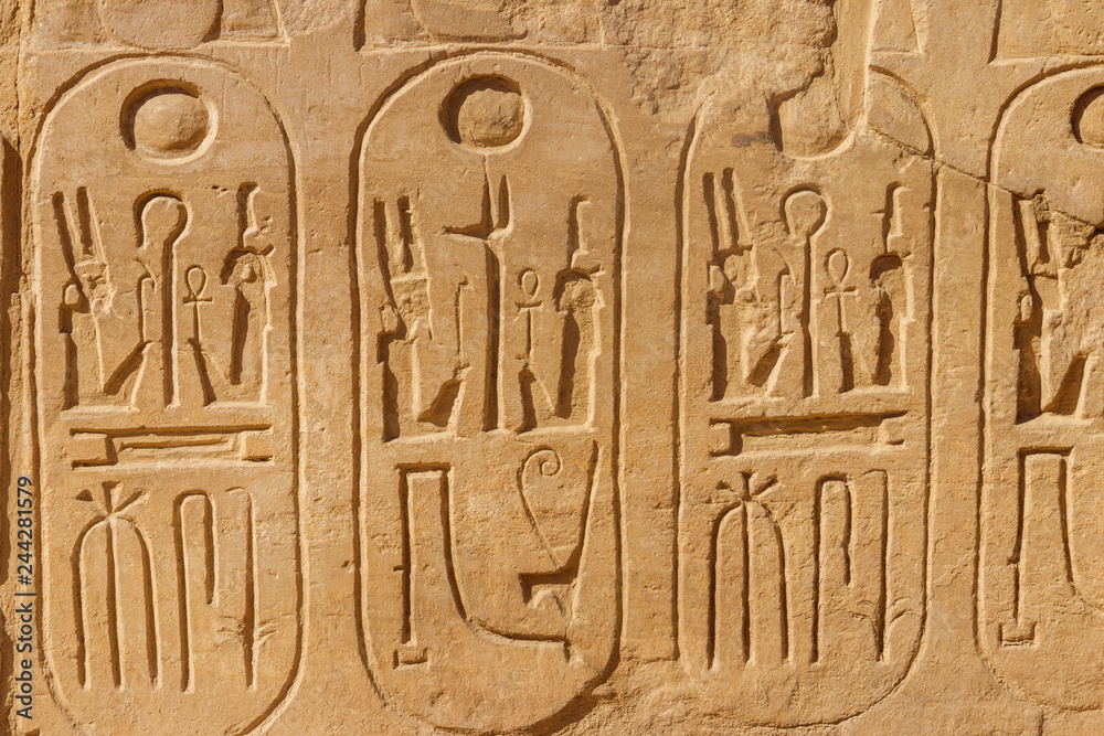 Ancient egyptian hieroglyphs on the wall in Karnak Temple Complex in Luxor, Egypt Ancient egyptian hieroglyphs on the wall in Karnak Temple Complex in Luxor, Egypt