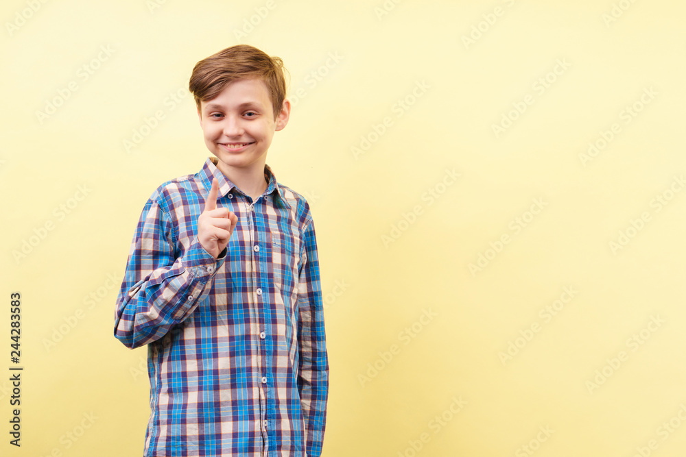 idea, enlightening, insight, comprehension. happy and confident grinning boy gesturing over yellow background, advertisement, banner or poster template, emotion, people reaction