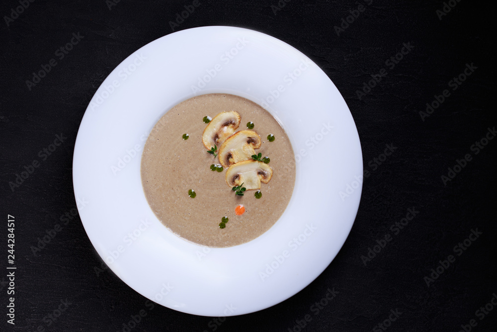 mushroom cream soup with herbs and spices, tasty nourishing lunch, starter meal. european cuisine, healthy food, restaurant menu mushroom cream soup with herbs and spices, tasty nourishing lunch, starter meal. european cuisine, healthy food, restaurant menu