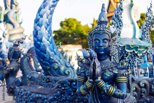 Canvas Print closeup buddha statue in rong sua ten temple (blue temple) with soft-focus and o
