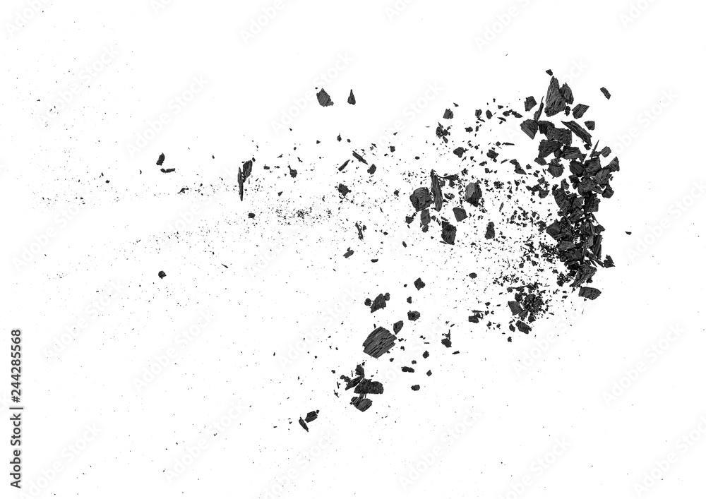 Small pieces of charcoal dust on white background, top view. Small pieces of charcoal dust on white background, top view.