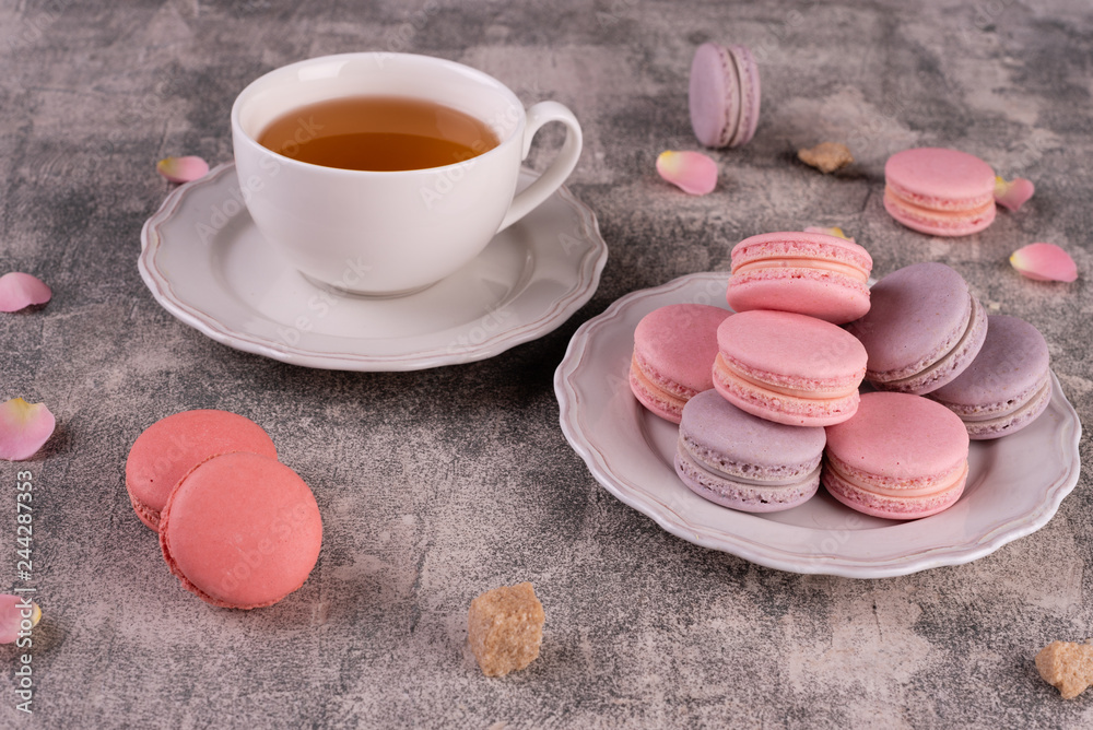 Wedding, St. Valentine's Day, birthday, preparation, holiday. Beautiful pink tasty macaroons on a concrete background Wedding, St. Valentine's Day, birthday, preparation, holiday. Beautiful pink tasty macaroons on a concrete background