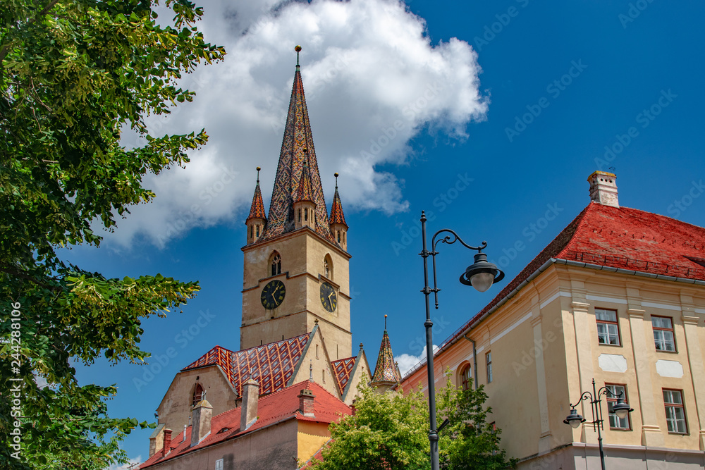 Fototapeta premium Lutheran Cathedral of Saint Mary on a beautiful sunny summer day in Sibiu, Transylvania region, Romania