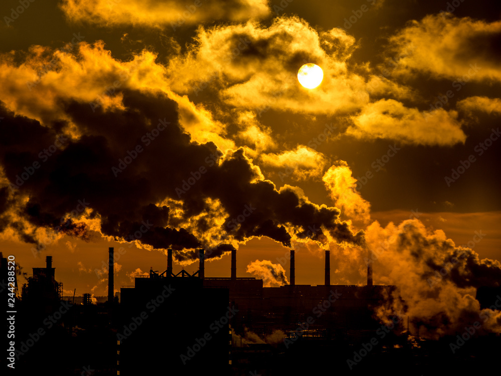 Fototapeta premium Industrial plant emitting heavy smoke