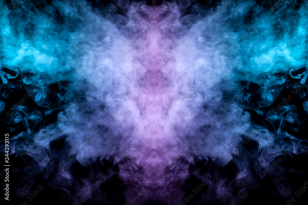 Fototapeta premium Abstract image of smoke of different green and pink colors in the form of horror in the form of the head of the face and eyes on a black isolated background. Soul and ghost in mystical form.