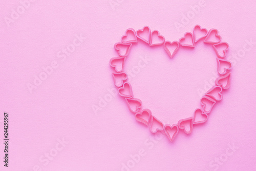 Heart from small hearts on a pink background for Valentine's Day