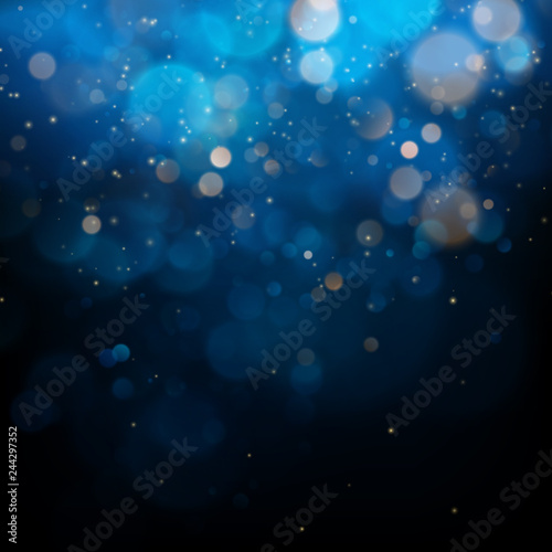 Blurred bokeh light on dark blue background. Christmas and New Year holidays template. Abstract glitter defocused blinking stars and sparks. EPS 10