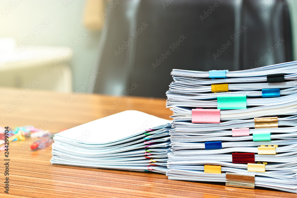 Document stacks arranged by various colored paper clips Document stacks arranged by various colored paper clips