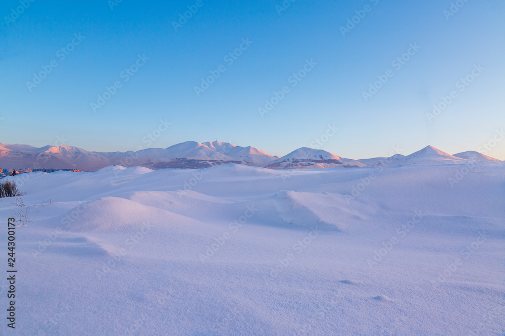 Snow dunes with palandoken mountains background in Erzurum, Turkey Snow dunes with palandoken mountains background in Erzurum, Turkey