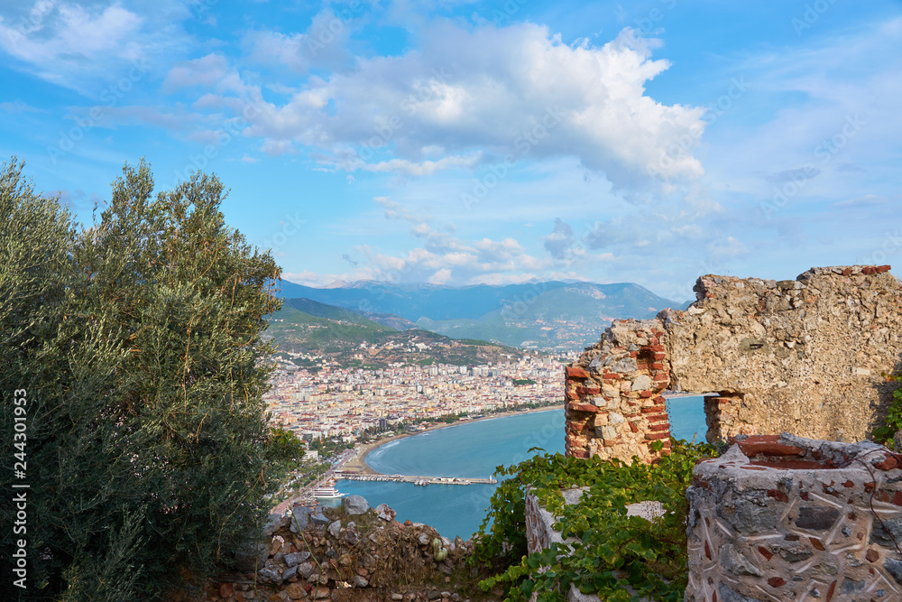 A part of medieval wall, mountains and sea shore of Alanya, Turkey. Natural background.