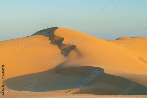 Fototapeta Naklejka Na Ścianę i Meble -  Sunrise at sand dunes. Stockton Beach, Australia