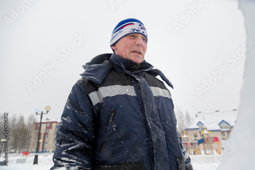 Portrait of an assembler in a blue jacket photo