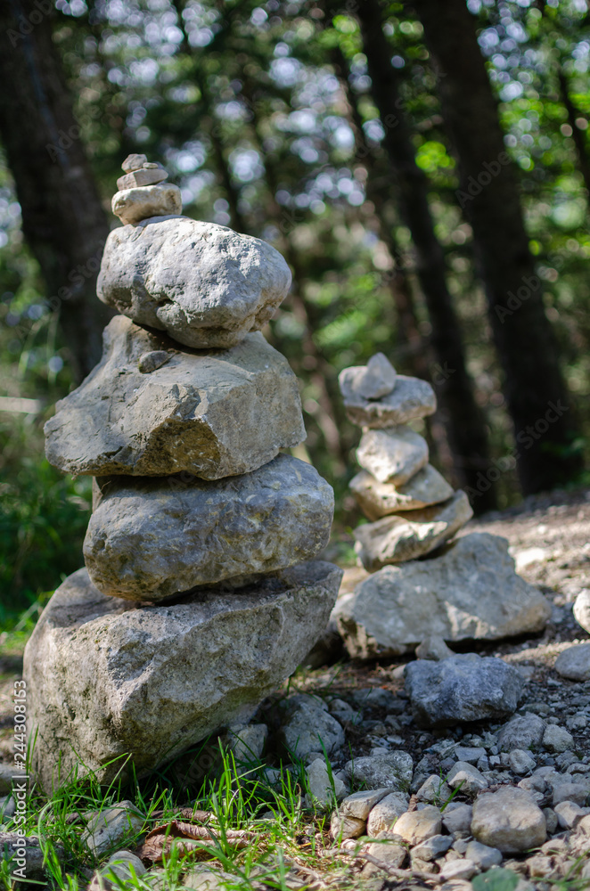 Stone figures on hiking path Stone figures on hiking path