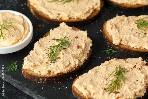 Fresh homemade smoked salmon pate on brown bread toast with dill