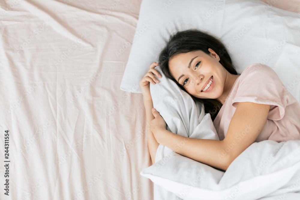 charming positive girl is resting at home. top view photo. copy space charming positive girl is resting at home. top view photo. copy space