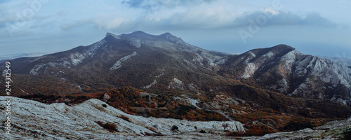 Panorama of a mountain rocky ridge in autumn