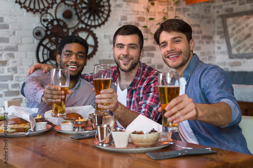 Friends meeting. Men sitting in beer pub