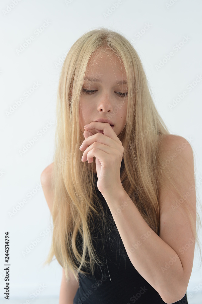 girl in black swimsuit with white hair smiling and showing emotions in the Studio girl in black swimsuit with white hair smiling and showing emotions in the Studio