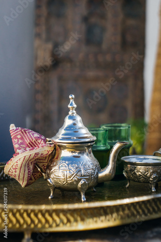 Arabian Mint Tea (Moroccan Mint Tea) The national hot drink in the Middle East and the Muslim world. Served in a special iron silver teapot with sugar. © uladzimirzuyeu