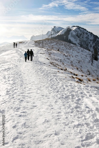 People walking down the path in the mountains in winter © Marek