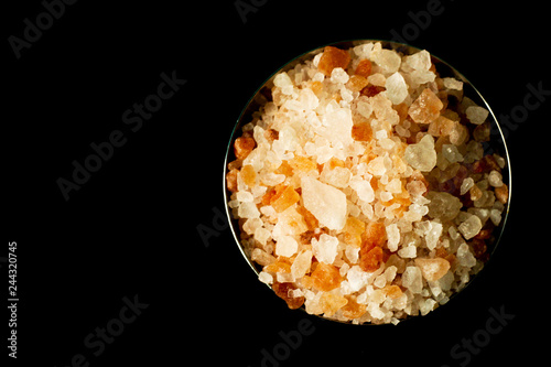 Himalayan pink salt, metal bowl, close up, black background