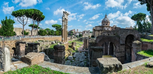 Panoramic View of the temple of Saturn in Roman forum, Italy. Ruins of Septimius Severus Arch and Saturn Temple. 