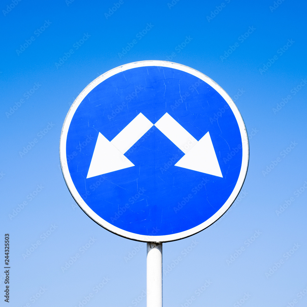 The sign of the crossing. Road signs. Sign on a blue background The sign of the crossing. Road signs. Sign on a blue background