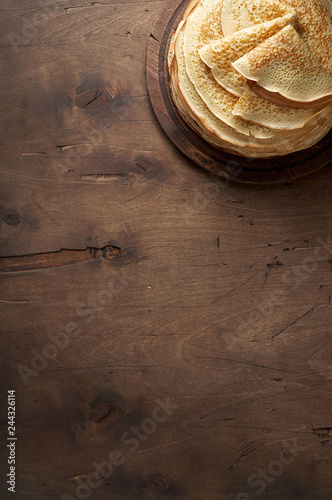Obraz na płótnie Stack of russian pancake blini on a wooden background w salonie