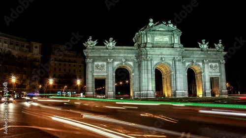 Beautiful Time lapse 4K of Puerta de Alcala in Madrid city Spain at night photo