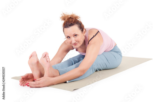 Beautiful Yoga: Senior Woman doing Virabhadrasana The Forward Bend Yogic Pose