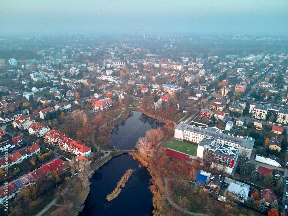 Fototapeta premium Beautiful panoramic aerial drone view to Cietrzewia ponds or Glinianki Cietrzewia - two water reservoirs, located in Warsaw, in the Włochy district