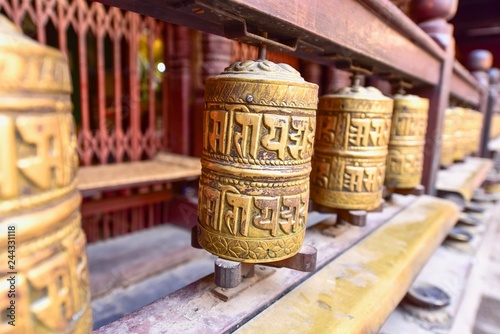 Sacred Tibetan Prayer Wheels at Patan Golden Temple in Nepal