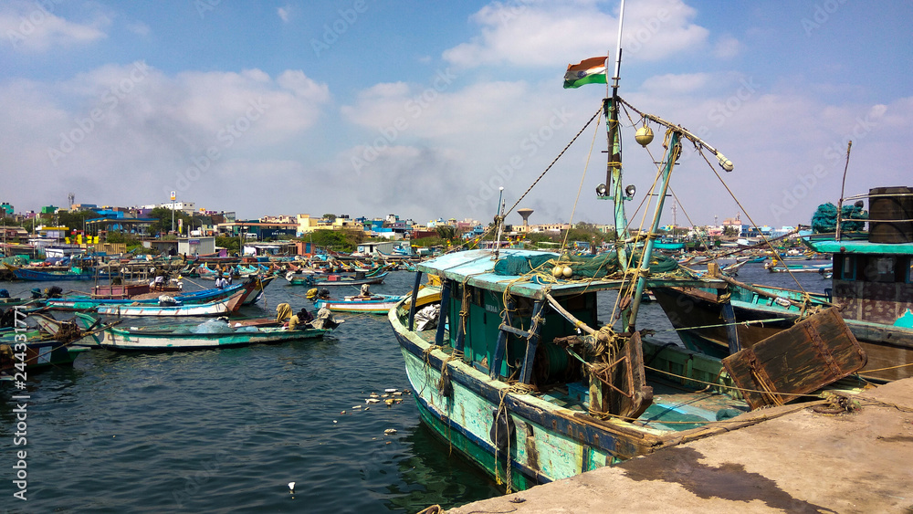 Men with Indian fishing boats and various equipment at Kasimedu fishing harbour of Royapuram area in Chennai. Men with Indian fishing boats and various equipment at Kasimedu fishing harbour of Royapuram area in Chennai.