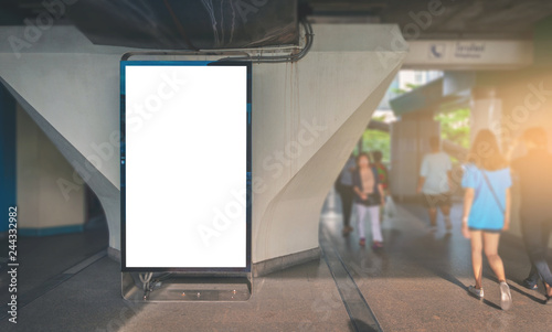 big LED billboard blank vertical white empty screen for media advertising text banner design outdoor with building and sky in city.