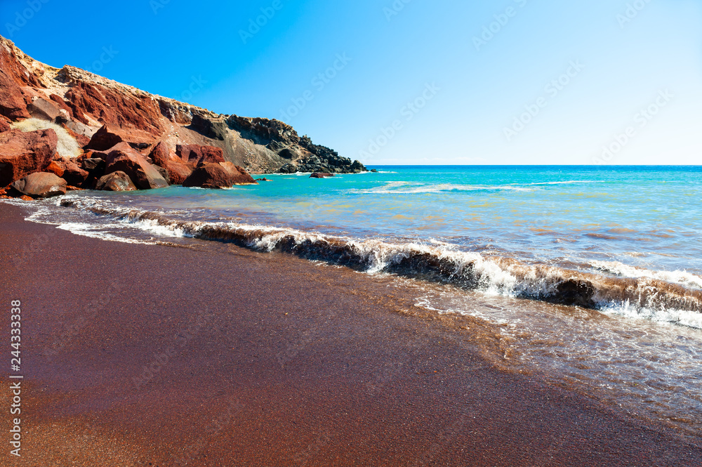 Red beach with turquoise water and volcanic sand on Santorini island, Greece.