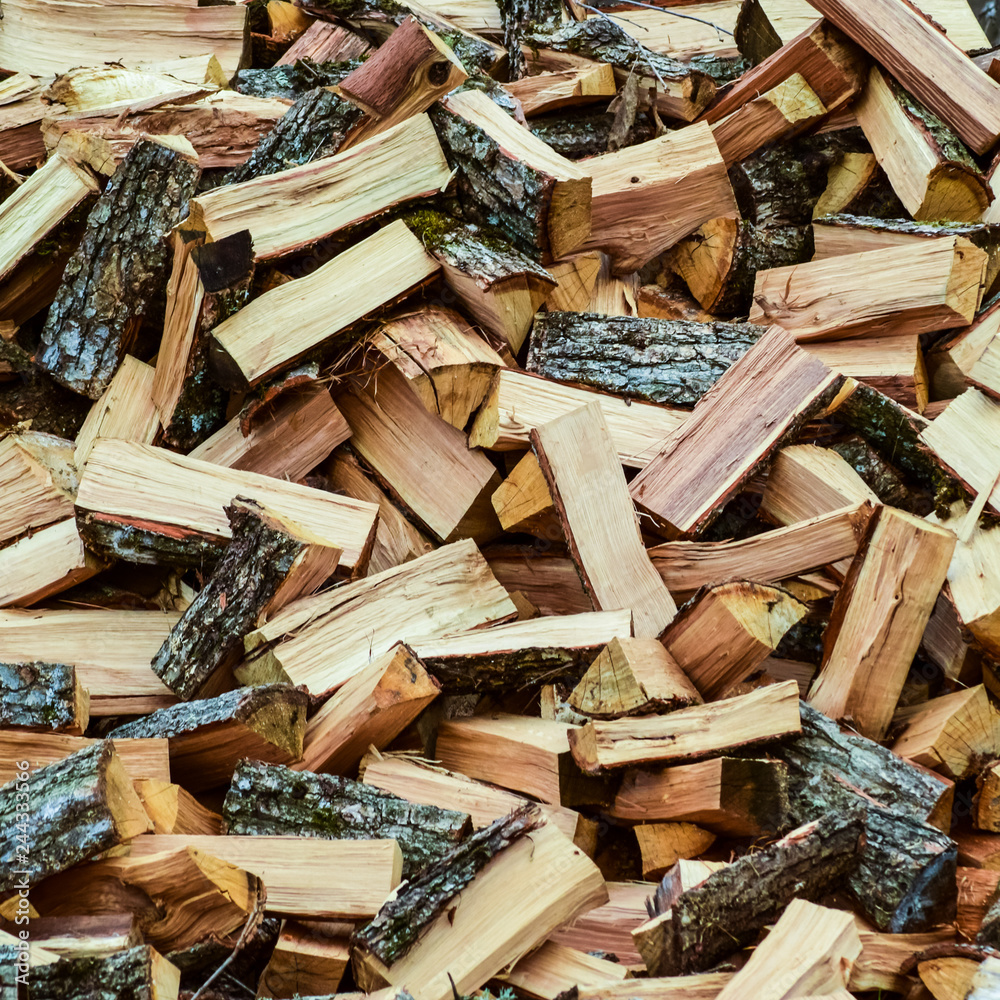 A pile of punctured firewood. Harvested wood for the stove A pile of punctured firewood. Harvested wood for the stove