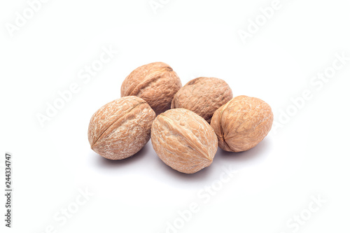 Group of walnuts in a shell isolated on a white background